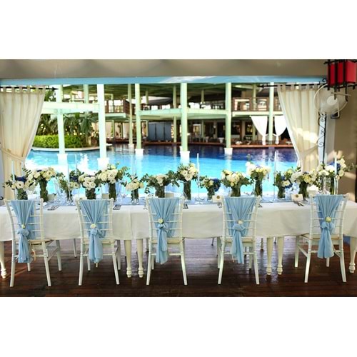 Table Decorated with Small Live Flowers in 3 Sizes of Glass Vases