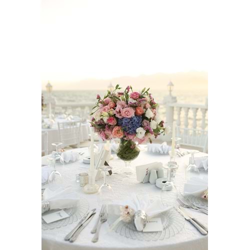 Round Table Decoration with Roses, Lisianthus, Hydrangeas, and Statice in a Short Glass Vase